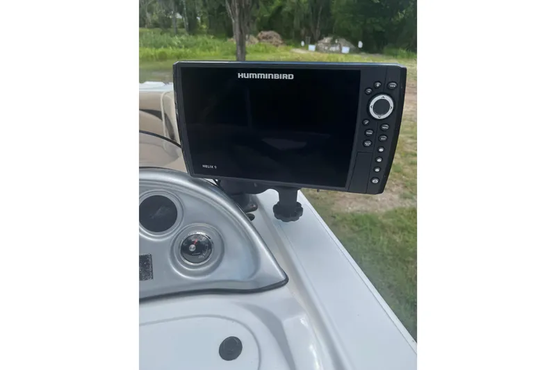 Slide: The Image of Helix 9 fish finder on 2016 Hurricane SunDeck Sport 203 OB boat dashboard. - 13