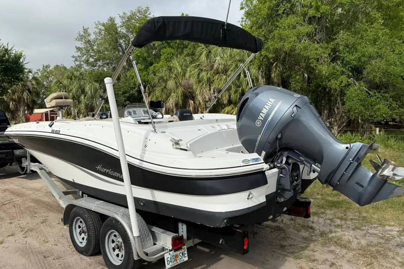 Slide: The Image of 2016 Hurricane SunDeck Sport 203 OB boat with Yamaha outboard motor on trailer. - 3