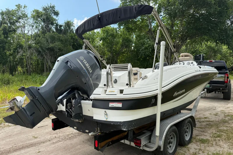 Slide: The Image of 2016 Hurricane SunDeck Sport 203 OB boat on trailer with Yamaha outboard motor. - 5