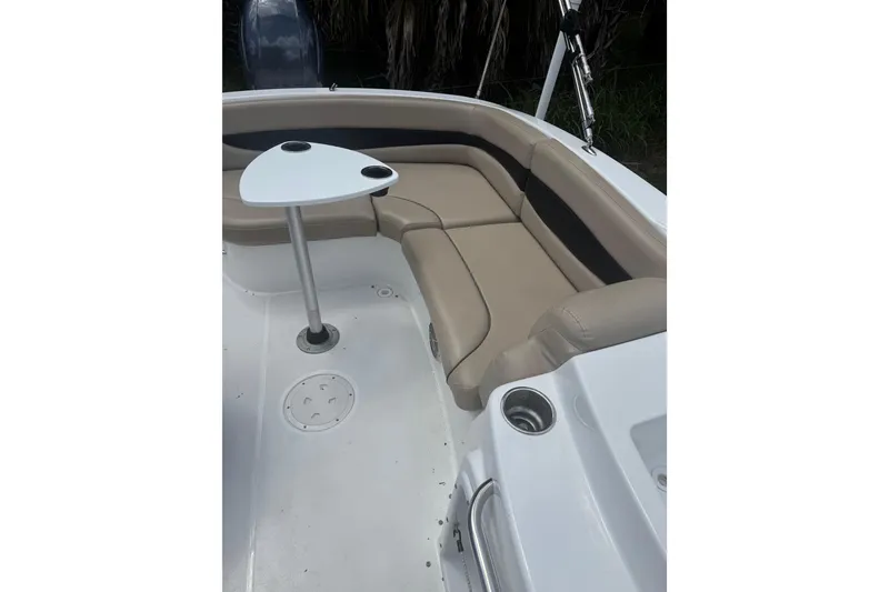 Slide: The Image of 2016 Hurricane SunDeck Sport 203 OB boat interior with seating and table. - 9