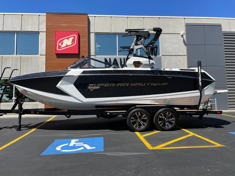 The Image of 2020 Nautique G23 boat parked in front of a building. - 1