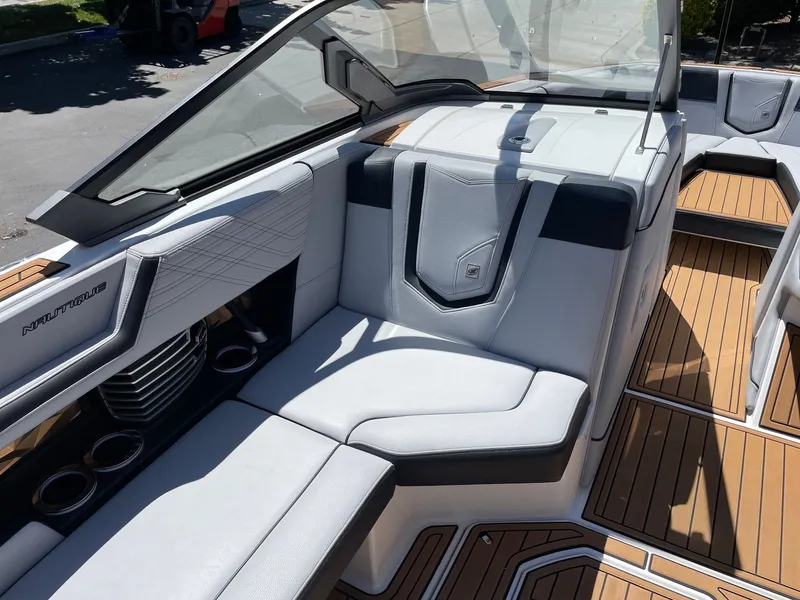 Slide: The Image of Interior of a 2020 Nautique G23 boat with luxurious seating. - 10
