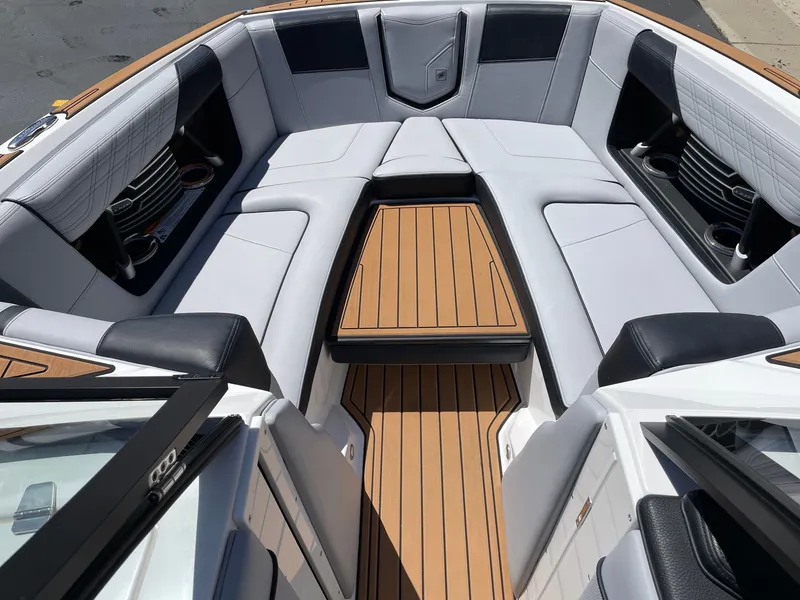 Slide: The Image of Interior of a 2020 Nautique G23 boat with luxurious seating. - 11