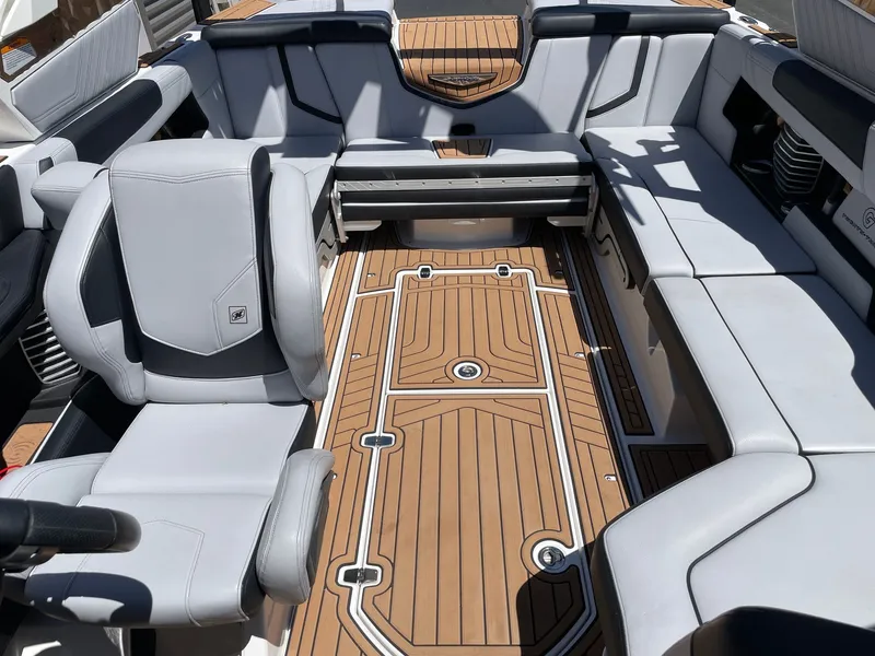 Slide: The Image of Interior of a 2020 Nautique G23 boat with luxurious seating. - 12