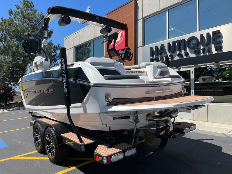 Slide: The Image of 2020 Nautique G23 boat outside a Utah dealership. - 3