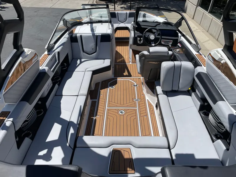 Slide: The Image of Interior of a 2020 Nautique G23 boat with luxurious seating. - 5