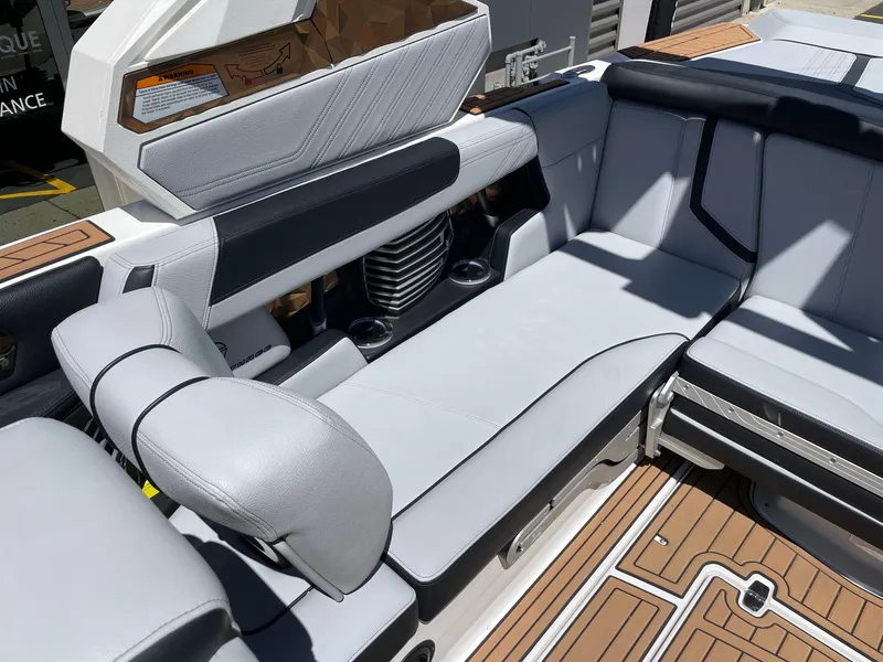 Slide: The Image of Interior of a 2020 Nautique G23 boat with gray seating. - 7