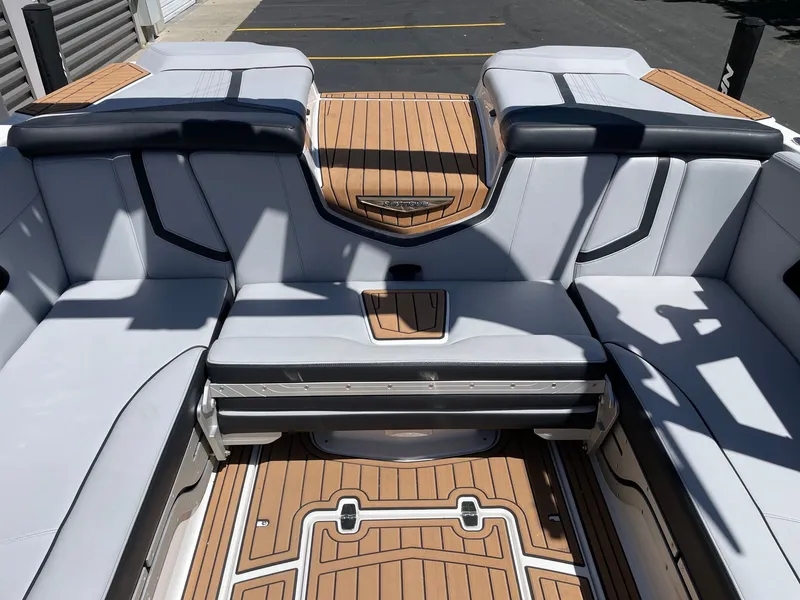 Slide: The Image of Interior of a 2020 Nautique G23 boat with luxurious seating. - 8