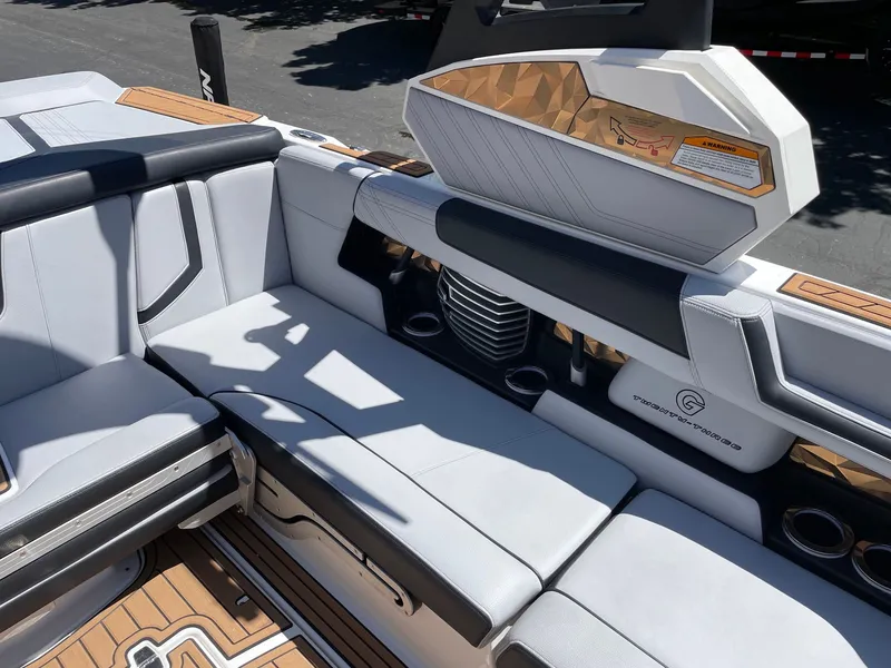 Slide: The Image of Interior of a 2020 Nautique G23 boat with luxurious seating. - 9