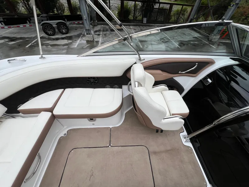 Slide: The Image of Interior of a 2014 Cobalt 243 boat with white leather seating. - 10