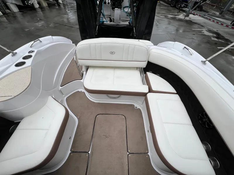 Slide: The Image of Interior of a 2014 Cobalt 243 boat with white seating. - 11