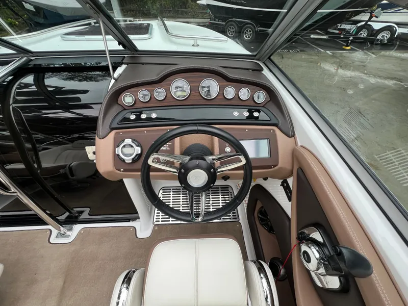 Slide: The Image of Interior view of a 2014 Cobalt 243 boat cockpit. - 15
