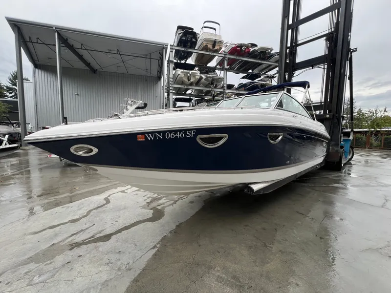 Slide: The Image of 2014 Cobalt 243 boat parked on a wet dock. - 3