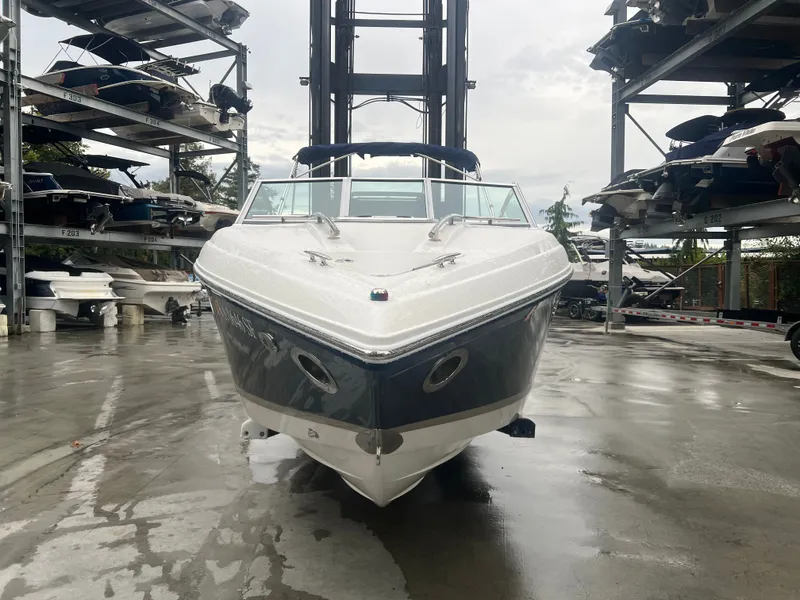 Slide: The Image of 2014 Cobalt 243 boat parked in a storage facility. - 4