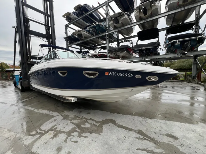 Slide: The Image of 2014 Cobalt 243 boat stored on a wet dock. - 5