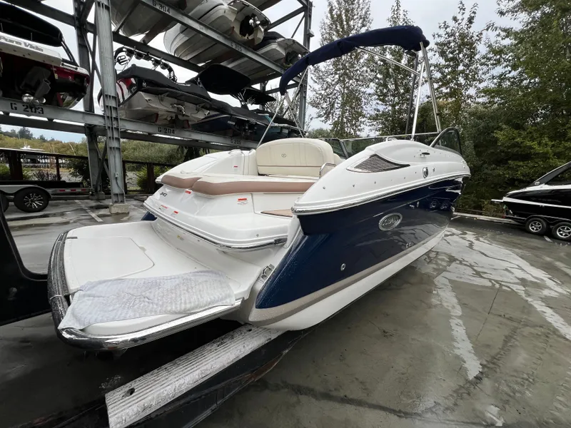 Slide: The Image of 2014 Cobalt 243 boat on an outdoor boat trailer. - 7