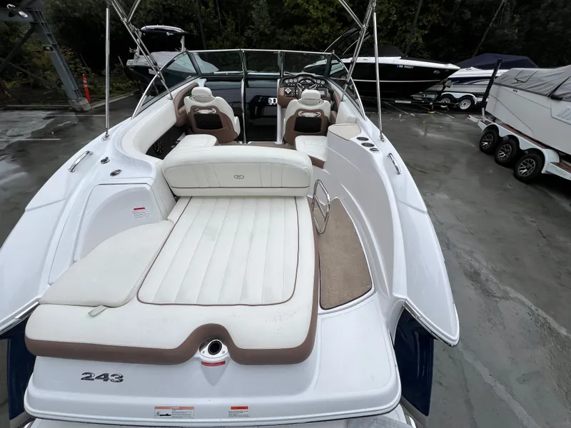 Slide: The Image of 2014 Cobalt 243 boat with luxurious interior and sunbathing area. - 9