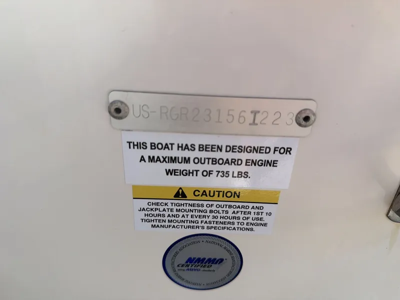Slide: The Image of Warning label on Ranger 2510 boat, maximum engine weight 735 lbs. - 13