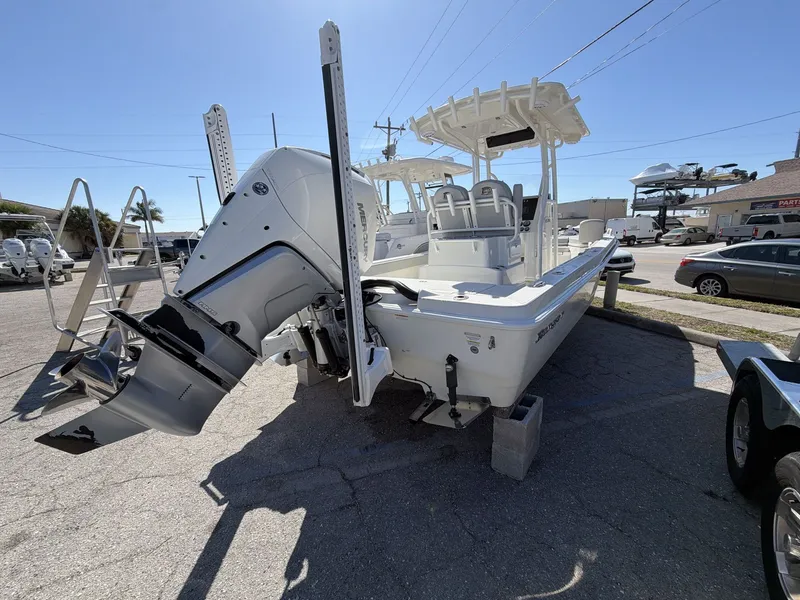 Slide: The Image of 2023 Ranger 2510 boat with outboard motor in parking lot. - 16