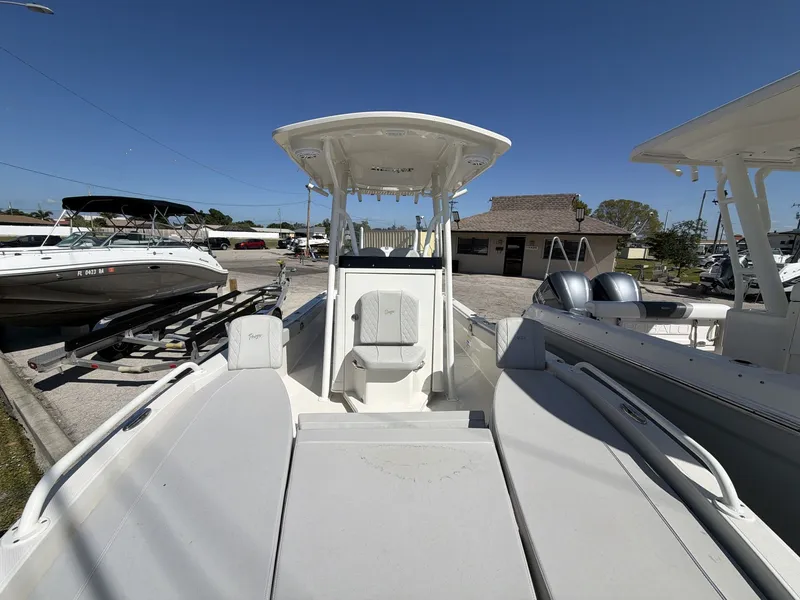 Slide: The Image of 2023 Ranger 2510 boat with center console and twin engines. - 19
