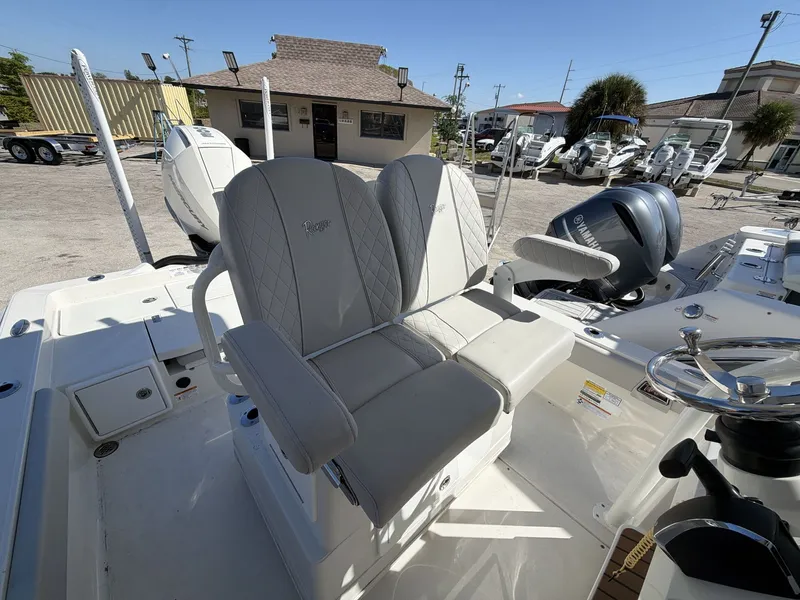 Slide: The Image of 2023 Ranger 2510 boat with luxurious seating and Yamaha engines. - 22