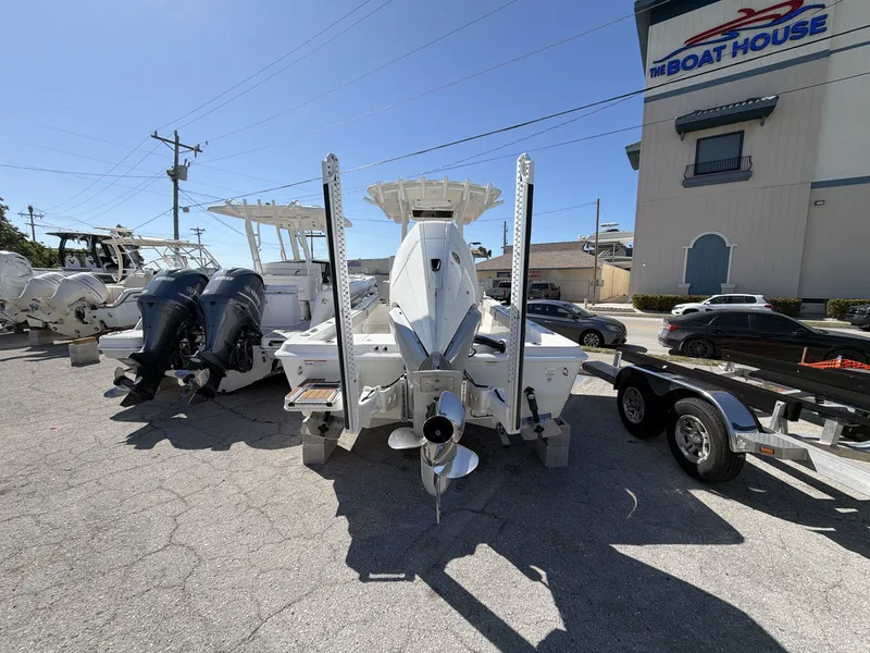 Slide: The Image of 2023 Ranger 2510 boat parked in front of a boat building. - 6