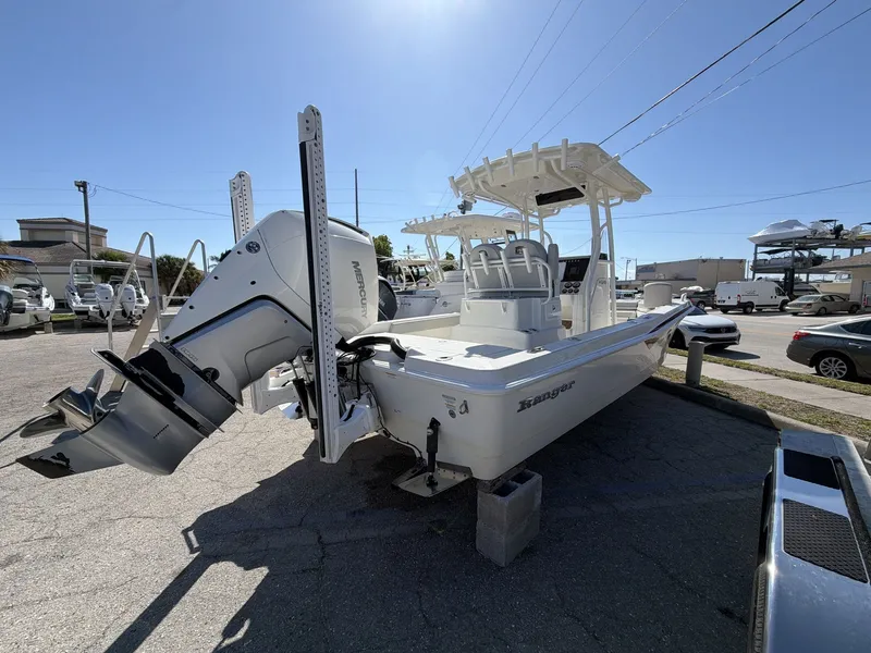 Slide: The Image of 2023 Ranger 2510 boat with Mercury outboard motor on parking lot. - 7