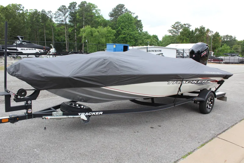 Slide: The Image of 2020 Tracker Pro Team 195 TXW TE boat with cover on trailer. - 13