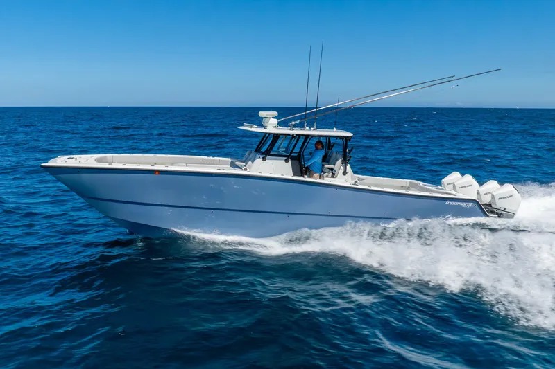 The Image of 2019 Freeman 42LR boat cruising on open ocean with clear blue skies. - 0