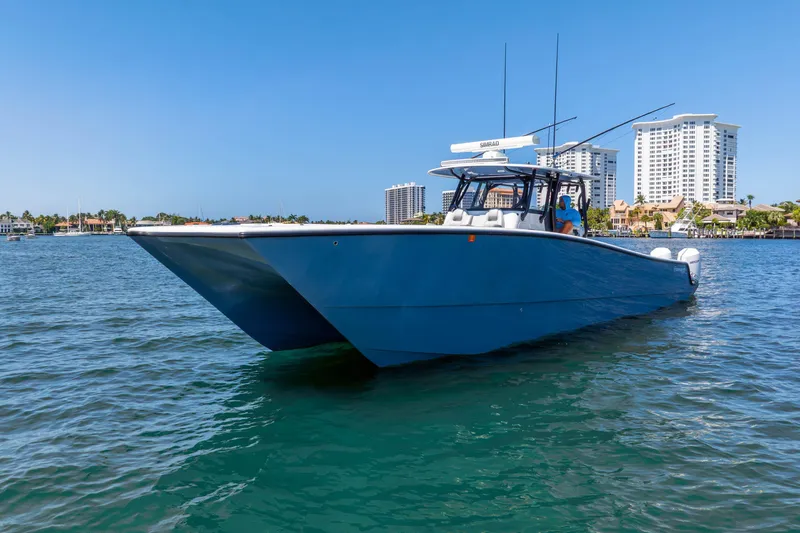 Slide: The Image of 2019 Freeman 42LR boat on water, with city skyline in background. - 11