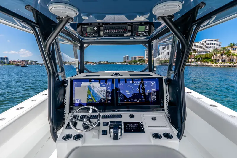 Slide: The Image of Cockpit view of 2019 Freeman 42LR boat with advanced navigation system on a sunny day. - 19