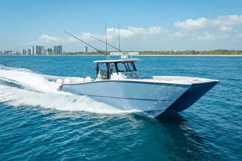 Slide: The Image of 2019 Freeman 42LR boat cruising on open blue ocean waters. - 2