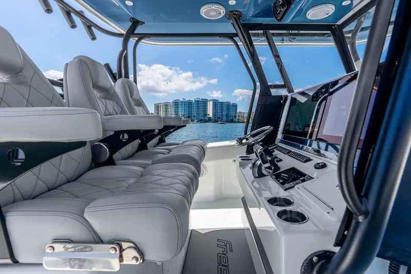 Slide: The Image of Luxurious interior of a 2019 Freeman 42LR boat with plush seating and advanced navigation. - 22