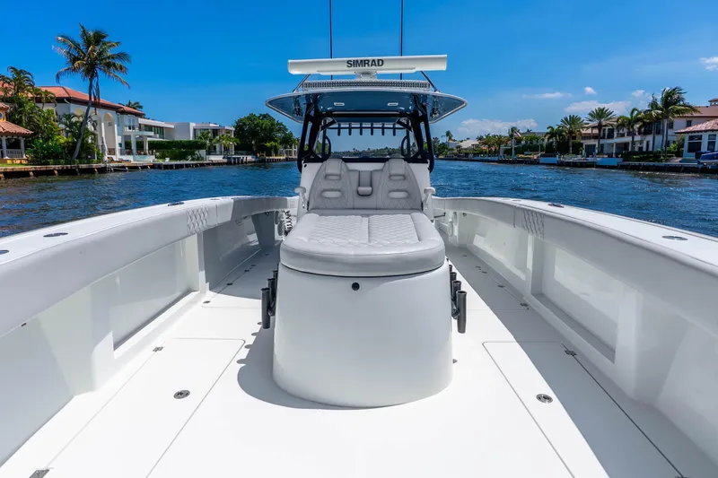 Slide: The Image of 2019 Freeman 42LR boat on a sunny waterway, featuring sleek design and modern amenities. - 25