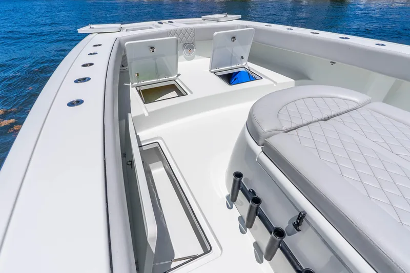 Slide: The Image of Luxurious 2019 Freeman 42LR boat interior with open storage compartments and cushioned seating. - 29