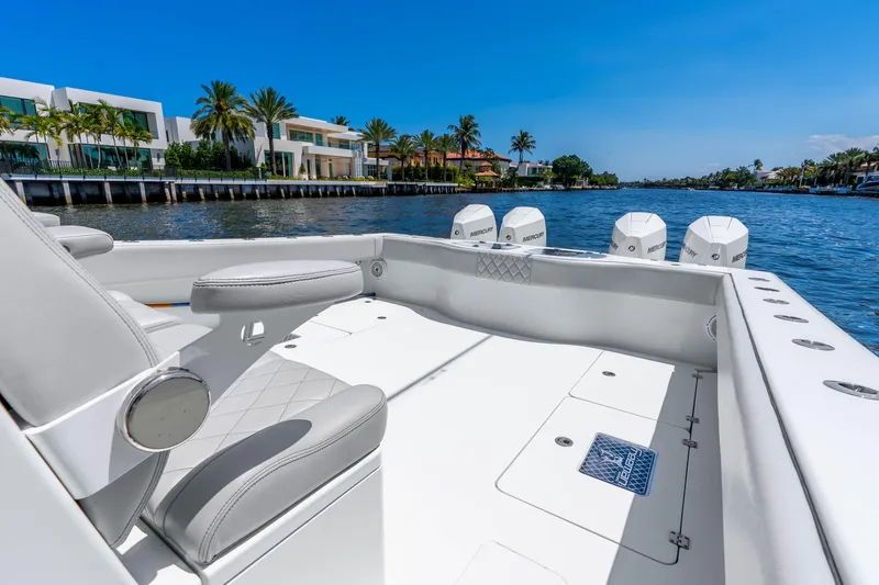Slide: The Image of Luxury Freeman 42LR boat interior with waterfront view, 2019 model, featuring sleek seating and powerful engines. - 32