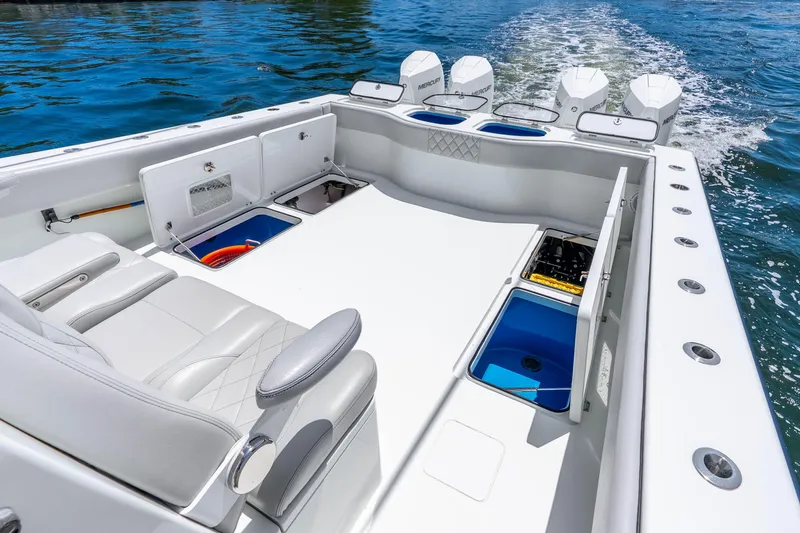 Slide: The Image of 2019 Freeman 42LR boat interior with seating, storage, and multiple outboard engines. - 34
