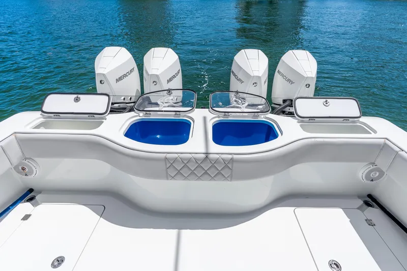 Slide: The Image of 2019 Freeman 42LR boat with Mercury engines and dual live wells on blue water. - 37