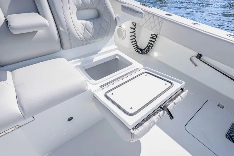 Slide: The Image of Luxurious seating and storage on a 2019 Freeman 42LR boat, featuring elegant design. - 50