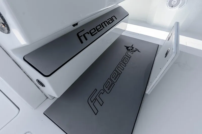 Slide: The Image of Freeman 42LR 2019 boat interior with branded flooring and seating. - 58
