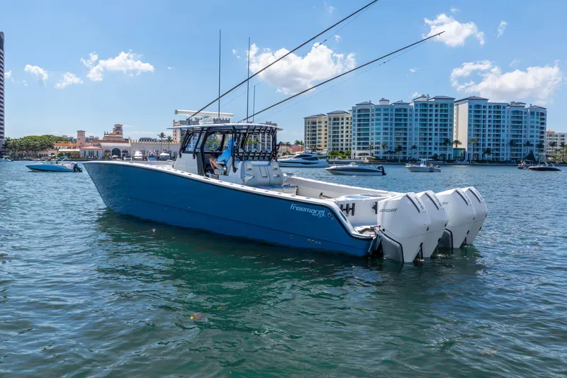 Slide: The Image of 2019 Freeman 42LR boat on water with cityscape background. - 9