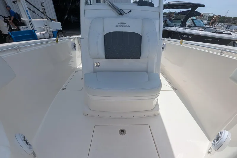 Slide: The Image of 2023 Cobia 301 Center Console boat interior with cushioned seating and sleek design. - 39