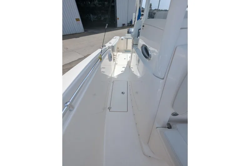 Slide: The Image of 2023 Cobia 301 Center Console boat deck, showcasing sleek design and spacious layout. - 41