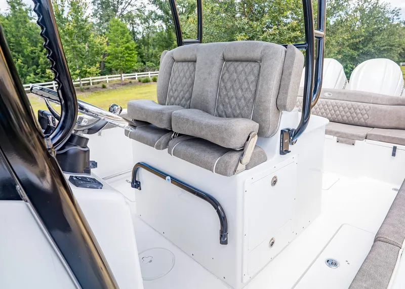 Slide: The Image of Interior of 2026 Sea Hunt Ultra 285 SE with cushioned seating. - 23