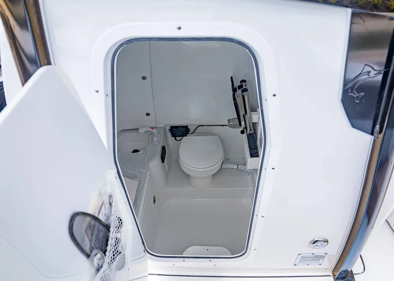 Slide: The Image of Interior view of the Sea Hunt Ultra 285 SE 2026 toilet. - 24