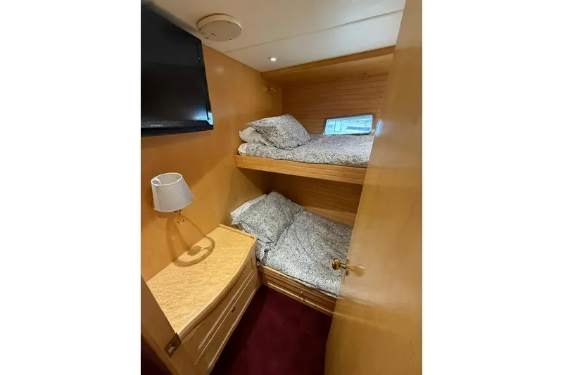 Slide: The Image of Cozy cabin with bunk beds in 1999 McKinna 57 Pilothouse yacht interior. - 16