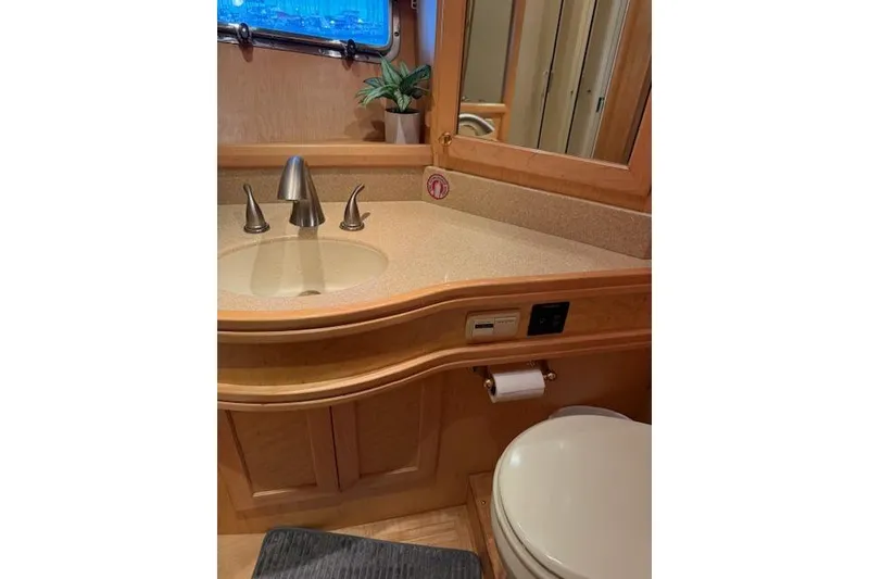 Slide: The Image of Bathroom interior of 1999 McKinna 57 Pilothouse yacht with sink and toilet. - 17