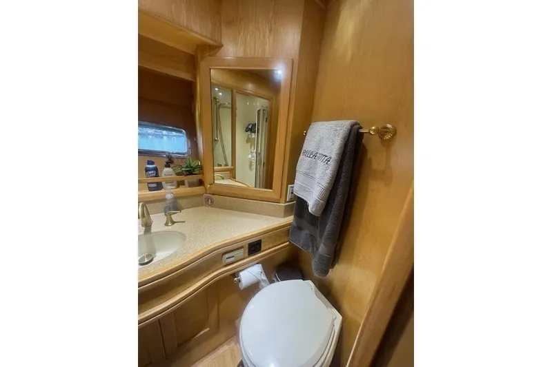 Slide: The Image of Bathroom interior of 1999 McKinna 57 Pilothouse yacht with wooden cabinetry. - 19