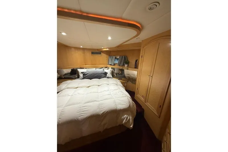 Slide: The Image of Luxurious bedroom interior of 1999 McKinna 57 Pilothouse yacht with cozy bedding. - 21