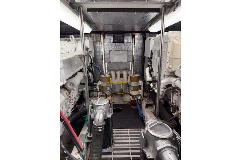 Slide: The Image of Engine room of a 1999 McKinna 57 Pilothouse yacht, showcasing mechanical components. - 29